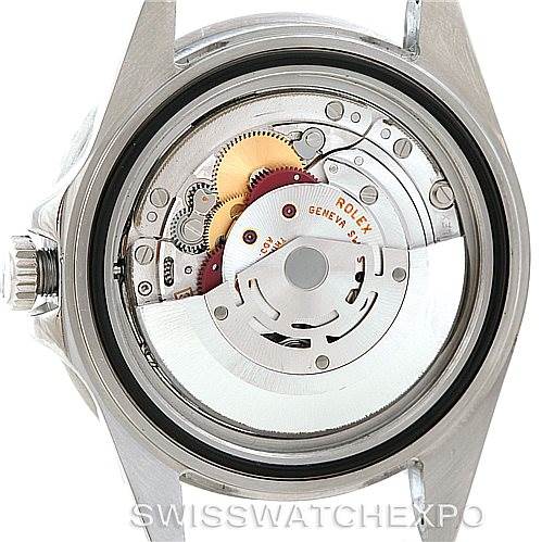 This is a view of the rear of a Rolex GMT-Master 16710 Men's Stainless Steel Black Dial 16710 Men's Stainless Steel Black Dial watch, showcasing its internal mechanism and movement components.