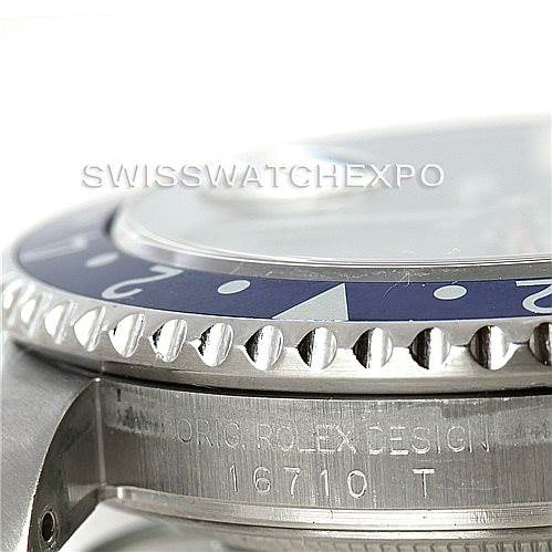 This close-up image shows the side of the bezel and the engraved case details of a Rolex GMT-Master 16710 Men's Stainless Steel Black Dial 16710 Men's Stainless Steel Black Dial model 16710.