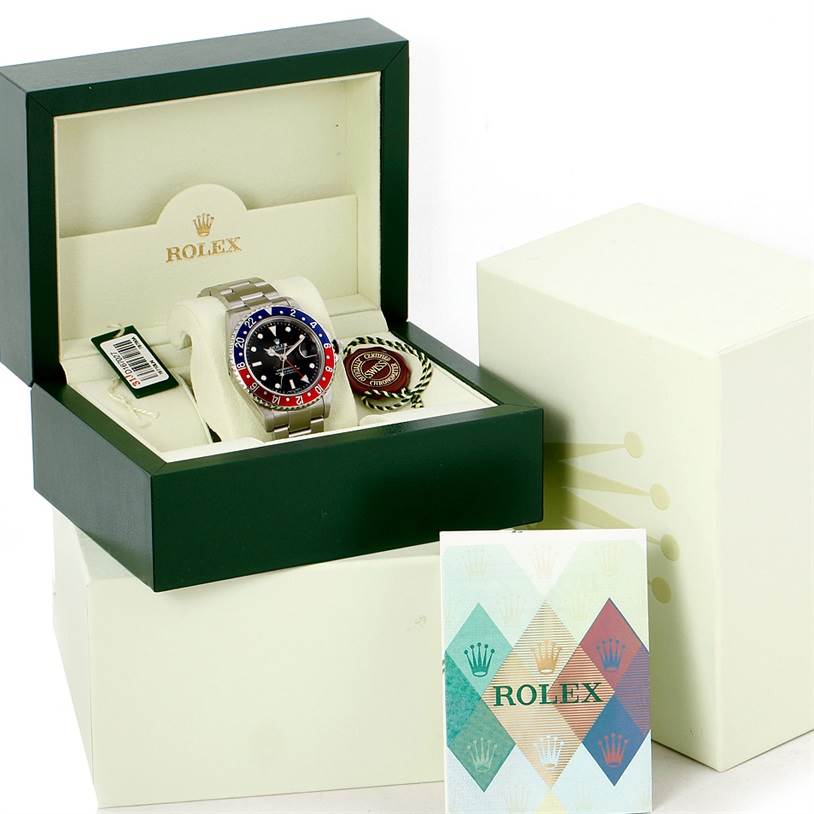 The Rolex GMT-Master 16710 Men's Stainless Steel Black Dial 16710 Men's Stainless Steel Black Dial watch is shown from the front inside its box, along with accessories and documentation.