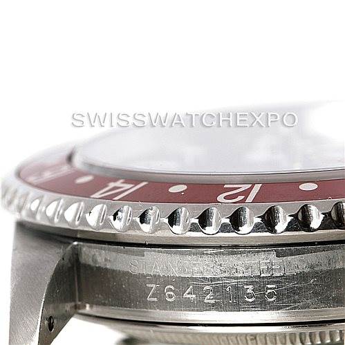 The image shows a close-up of the Rolex GMT-Master 16710 Men's Stainless Steel Black Dial 16710 Men's Stainless Steel Black Dial's bezel, case, and serial number from a side angle.