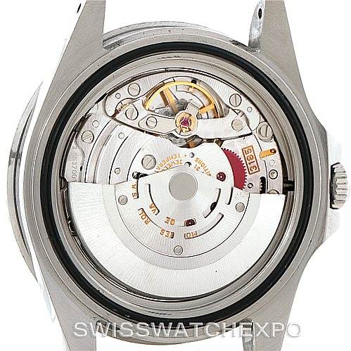 This image shows the open case back of a Rolex GMT-Master 16710 Men's Stainless Steel Black Dial 16710 Men's Stainless Steel Black Dial, exposing its mechanical movement and rotor.