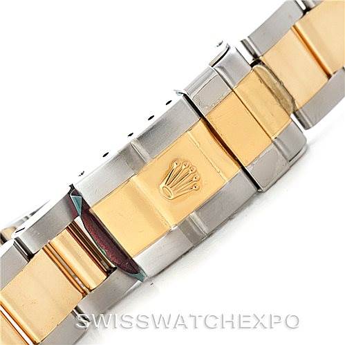 The image shows a close-up of the bracelet and clasp of a Rolex GMT-Master 16713 Men's Stainless Steel Grey Dial 16713 Men's Stainless Steel Grey Dial watch, featuring a two-tone design with yellow gold and stainless steel.