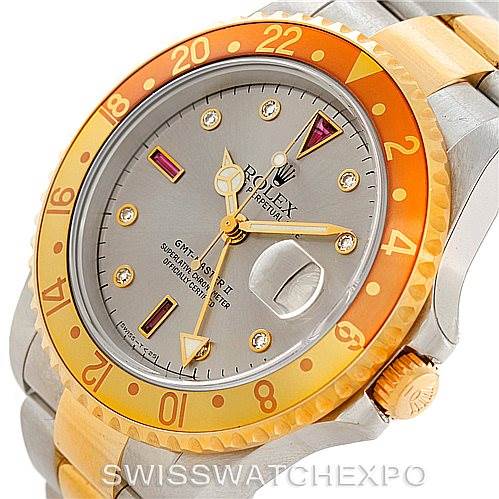 This image shows the watch face and bezel of a Rolex GMT-Master 16713 Men's Stainless Steel Grey Dial 16713 Men's Stainless Steel Grey Dial, highlighting its dial, hands, and part of the bracelet.