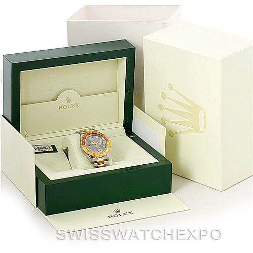 This is a displayed Rolex GMT-Master 16713 Men's Stainless Steel Grey Dial 16713 Men's Stainless Steel Grey Dial watch in an open green and beige box, showing the watch face and part of the bracelet.