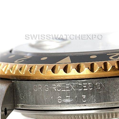 This image shows a close-up angle of the side view of a Rolex GMT-Master 16713 Men's Stainless Steel Black Dial 16713 Men's Stainless Steel Black Dial watch, highlighting the engraved model number, bezel, and part of the case.