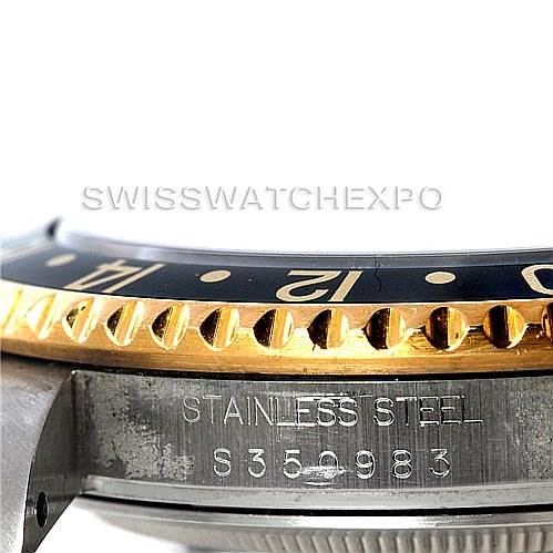 The image shows a close-up angled view of the side of a Rolex GMT-Master 16713 Men's Stainless Steel Black Dial 16713 Men's Stainless Steel Black Dial watch, focusing on the bezel and part of the stainless steel case with the serial number.