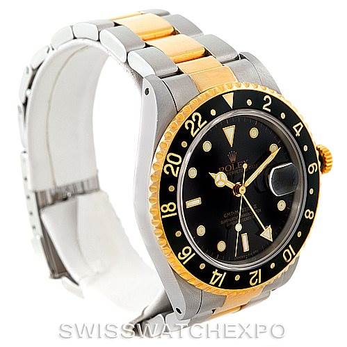 This image shows a Rolex GMT-Master 16713 Men's Stainless Steel Black Dial 16713 Men's Stainless Steel Black Dial watch at a three-quarter angle, highlighting its bezel, dial, crown, and two-tone bracelet.
