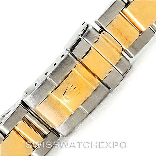 The image shows a close-up of the two-tone metal bracelet of a Rolex GMT-Master 16713 Men
s Stainless Steel Black Dial 16713 Men
s Stainless Steel Black Dial watch, highlighting the clasp and links.