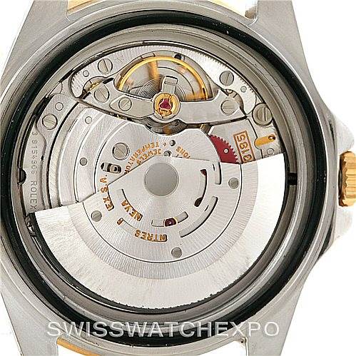 The image shows the back view of a Rolex GMT-Master 16713 Men
s Stainless Steel Black Dial 16713 Men
s Stainless Steel Black Dial, exposing its internal mechanical movement.