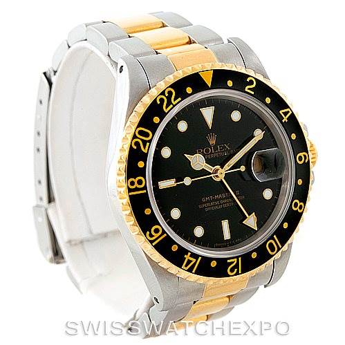 The image shows a Rolex GMT-Master 16713 Men's Stainless Steel Black Dial 16713 Men's Stainless Steel Black Dial watch angled from the left front, displaying its bezel, dial, and two-tone bracelet.