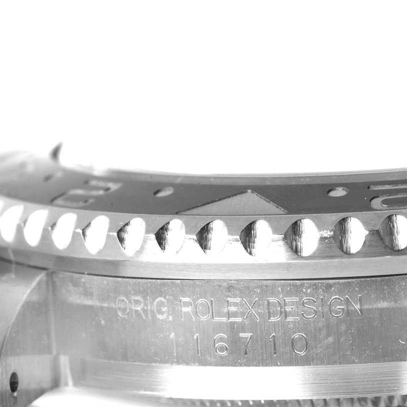 This close-up image of a Rolex GMT-Master 116710 Men's Stainless Steel Black Dial 116710 Men's Stainless Steel Black Dial shows the bezel and part of the case, including the "ORIG ROLEX DESIGN" engraving with model number 116710.