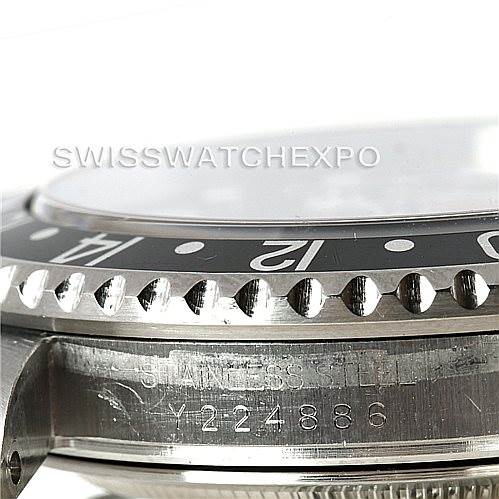 This close-up angle shows the bezel, part of the crystal, and the stainless steel casing with the serial number of the Rolex GMT-Master 16710 Men's Stainless Steel Black Dial 16710 Men's Stainless Steel Black Dial.