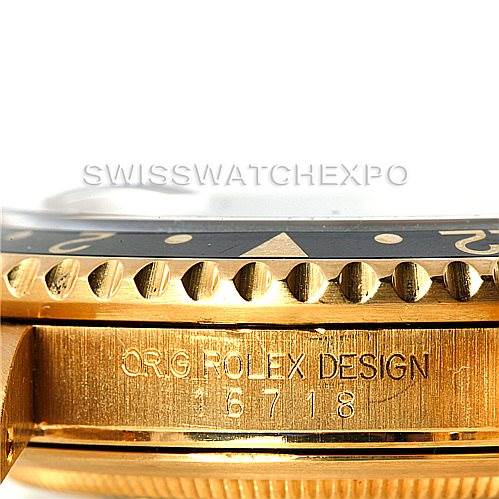 The image shows a close-up of the side of a Rolex GMT-Master 16718 Men's Yellow Gold Black Dial 16718 Men's Yellow Gold Black Dial watch, highlighting the bezel and case with "Orig Rolex Design 16718" engraved.