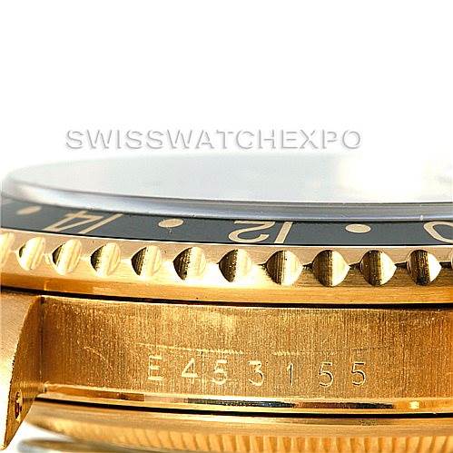 This image shows a close-up side view of the bezel and case with the serial number of the Rolex GMT-Master 16718 Men's Yellow Gold Black Dial 16718 Men's Yellow Gold Black Dial watch.