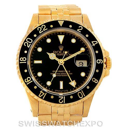 The image shows a front view of a Rolex GMT-Master 16718 Men's Yellow Gold Black Dial 16718 Men's Yellow Gold Black Dial watch, highlighting its dial, bezel, and bracelet.