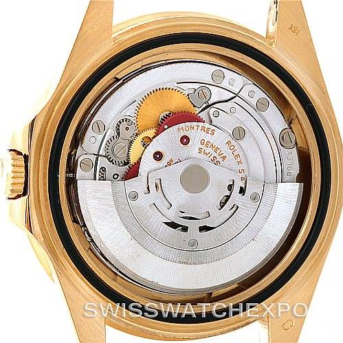 This image shows the back view of a Rolex GMT-Master 16718 Men's Yellow Gold Black Dial 16718 Men's Yellow Gold Black Dial watch, highlighting its internal movement mechanism.