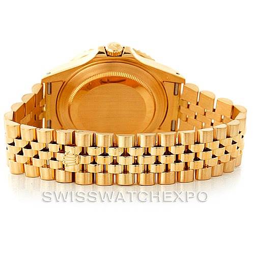 This image shows the back of a Rolex GMT-Master 16718 Men's Yellow Gold Black Dial 16718 Men's Yellow Gold Black Dial watch, focusing on the case back and Jubilee bracelet.