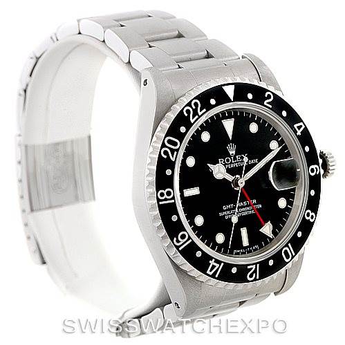 The image shows a Rolex GMT-Master 16700 Men's Stainless Steel Black Dial 16700 Men's Stainless Steel Black Dial watch taken from a three-quarter angle showcasing the face, bezel, and partial bracelet.