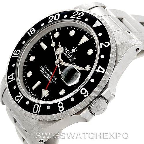 The image shows a close-up angle of the Rolex GMT-Master 16700 Men's Stainless Steel Black Dial 16700 Men's Stainless Steel Black Dial watch focusing on its black dial, bezel, and part of the bracelet.