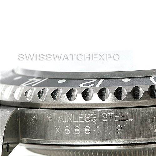 The image shows a side angle of a Rolex GMT-Master 16700 Men's Stainless Steel Black Dial 16700 Men's Stainless Steel Black Dial watch focusing on the stainless steel case and the engraved serial number.