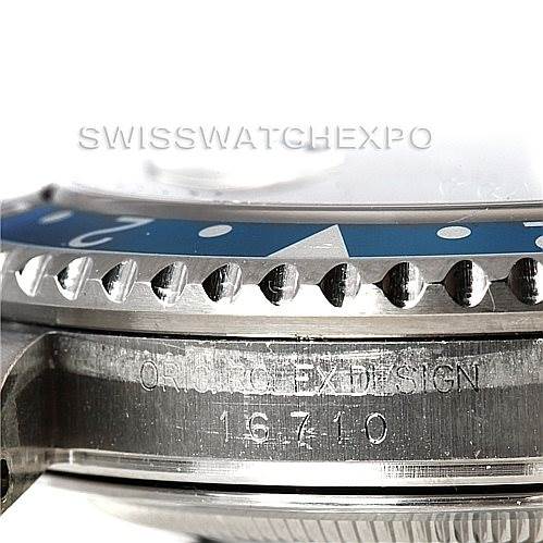 This image showcases the side profile of the bezel and case for a Rolex GMT-Master 16710 Men's Stainless Steel Black Dial 16710 Men's Stainless Steel Black Dial model, displaying the serial number and "ORIG ROLEX DESIGN" engraving.