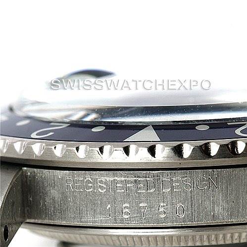 This image shows a close-up of the side and bezel of a Rolex GMT-Master 16750 Men's Stainless Steel Black Dial 16750 Men's Stainless Steel Black Dial watch with the "REGISTERED DESIGN 16750" engraving.