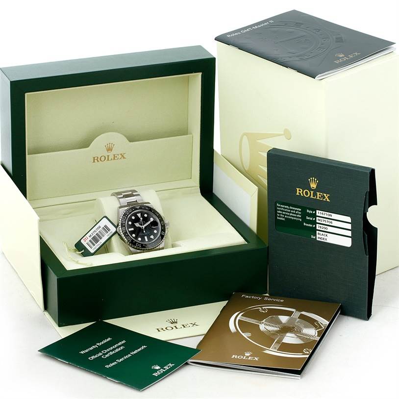 The Rolex GMT-Master 116710 Men
s Stainless Steel Black Dial 116710 Men
s Stainless Steel Black Dial watch is displayed front-facing in its box, alongside its warranty card, booklet, and packaging.