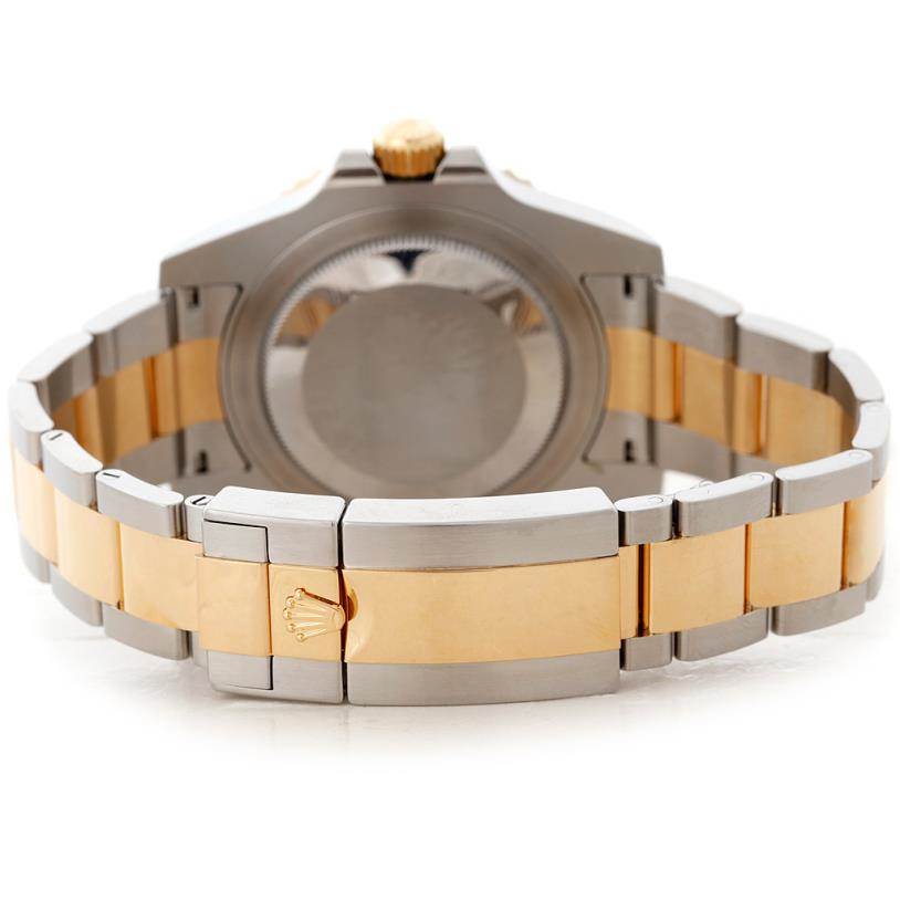 This Rolex GMT-Master 116713 Men's Stainless Steel Black Dial 116713 Men's Stainless Steel Black Dial watch is shown from the backside, highlighting its two-tone metal bracelet and clasp.