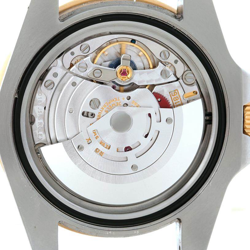 This image shows the back view of the Rolex GMT-Master 116713 Men's Stainless Steel Black Dial 116713 Men's Stainless Steel Black Dial watch, revealing its internal mechanical movement.