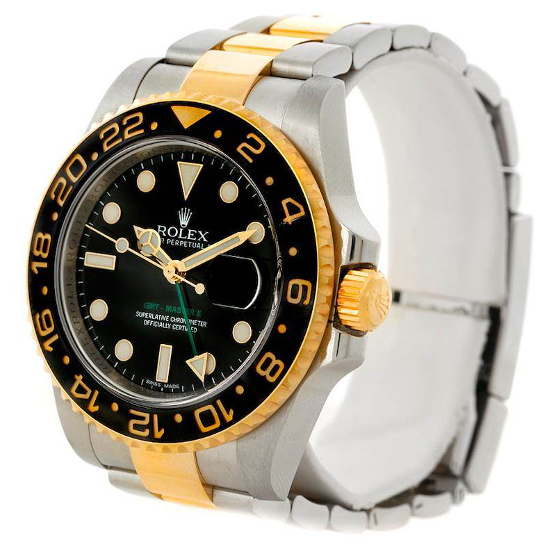 The Rolex GMT-Master watch is shown at an oblique angle, highlighting its bezel, dial, crown, and two-tone bracelet.