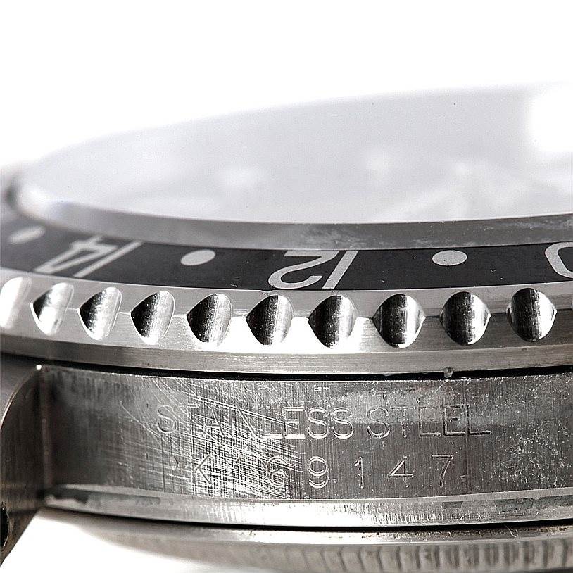 This close-up angle shows the bezel, case, and part of the serial number engraving of the Rolex GMT-Master 16710 Men
s Stainless Steel Black Dial 16710 Men
s Stainless Steel Black Dial watch.