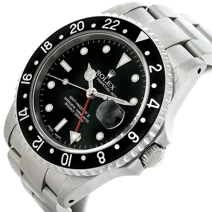 The image shows a close-up of the face and bezel of a Rolex GMT-Master 16710 Men
s Stainless Steel Black Dial 16710 Men
s Stainless Steel Black Dial watch at a slight angle.