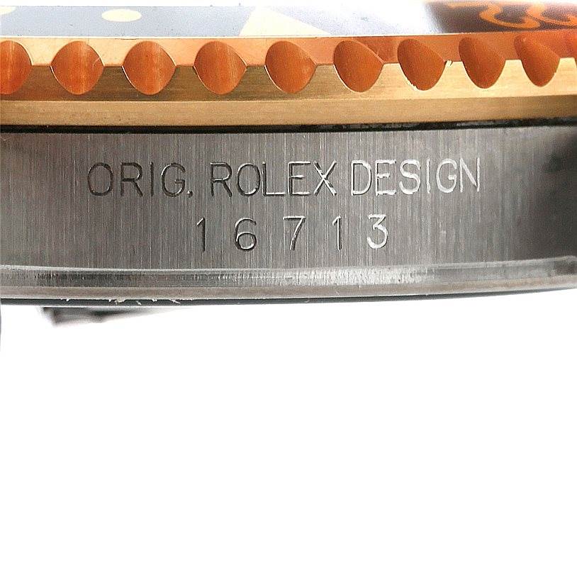 The image shows a close-up of the Rolex GMT-Master 16713 Men's Stainless Steel Black Dial 16713 Men's Stainless Steel Black Dial model's side, focusing on the engraved model number 16713 and "ORIG. ROLEX DESIGN."