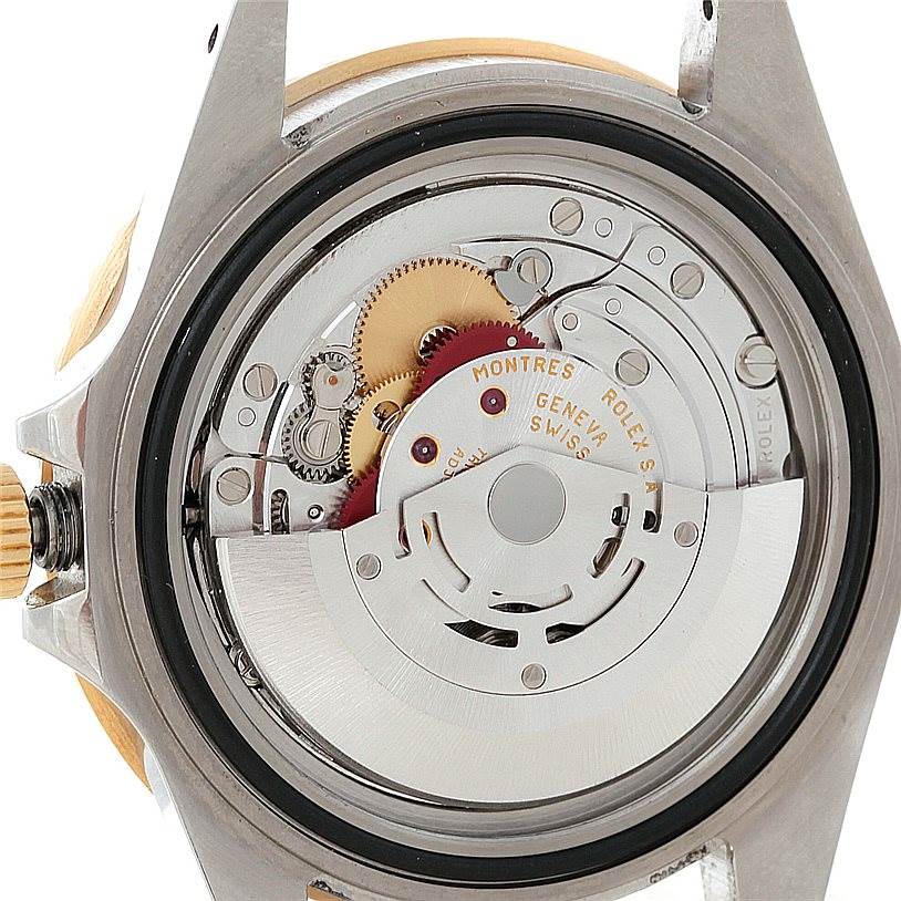 The image shows the back view of the Rolex GMT-Master 16713 Men's Stainless Steel Black Dial 16713 Men's Stainless Steel Black Dial watch, revealing its intricate internal mechanical movement.