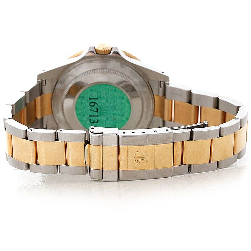 This image shows the back view of a Rolex GMT-Master 16713 Men's Stainless Steel Black Dial 16713 Men's Stainless Steel Black Dial watch, including its two-tone bracelet and clasp.