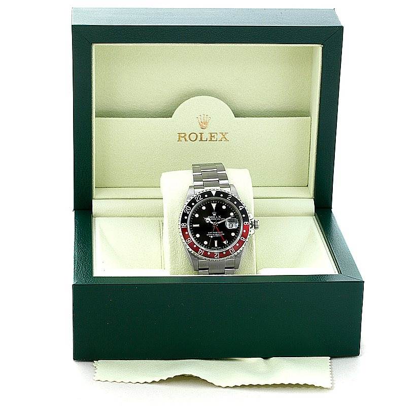 The Rolex GMT-Master 16710 Men's Stainless Steel Black Dial 16710 Men's Stainless Steel Black Dial watch is shown from the front within its green presentation box, displaying its bezel, dial, and bracelet.