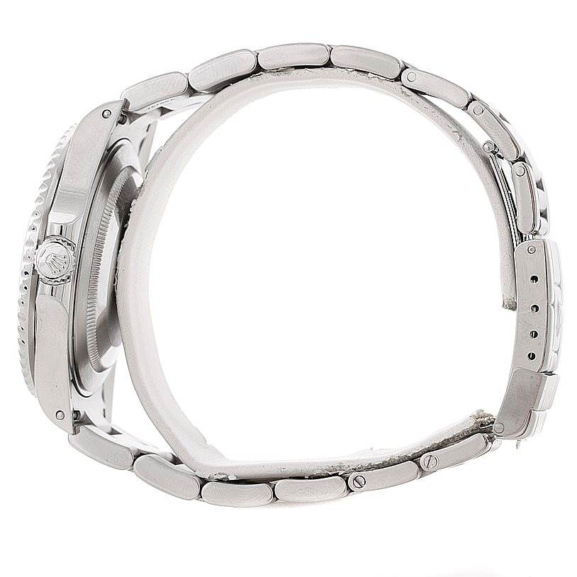 Side view of a Rolex GMT-Master 16710 Men's Stainless Steel Black Dial 16710 Men's Stainless Steel Black Dial, showing the crown, case, and partially open bracelet.