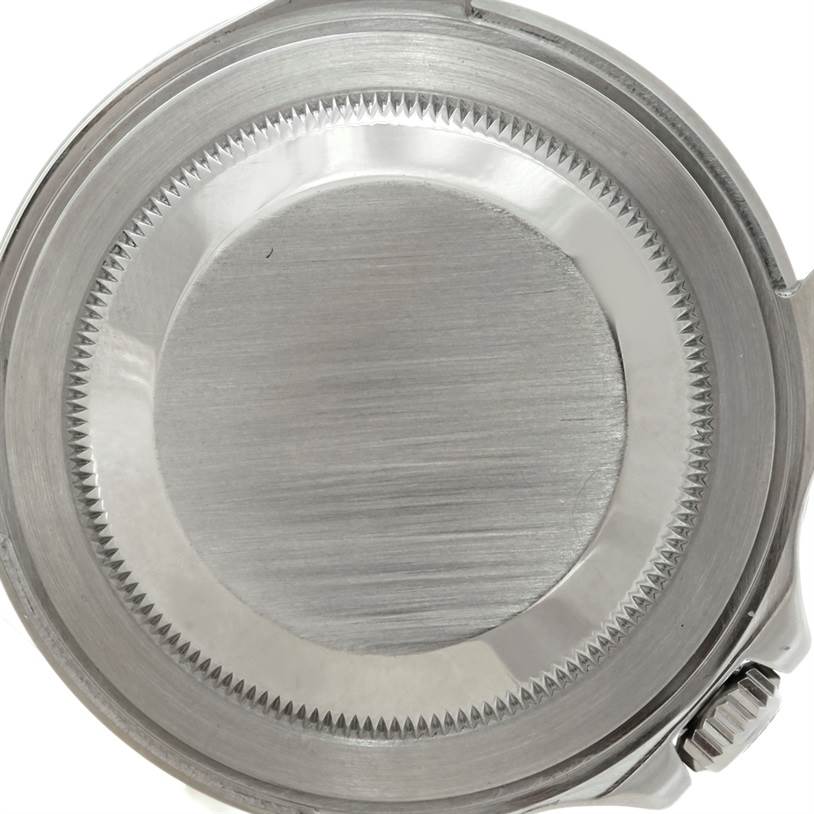 This image shows the back case of a Rolex GMT-Master 16710 Men's Stainless Steel Black Dial 16710 Men's Stainless Steel Black Dial watch, featuring a brushed metal finish and serrated edges.