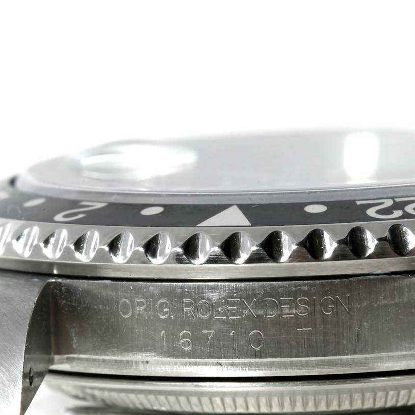 This close-up image shows the bezel, and part of the case of the Rolex GMT-Master 16710 Men's Stainless Steel Black Dial 16710 Men's Stainless Steel Black Dial model, highlighting the model number 16710.