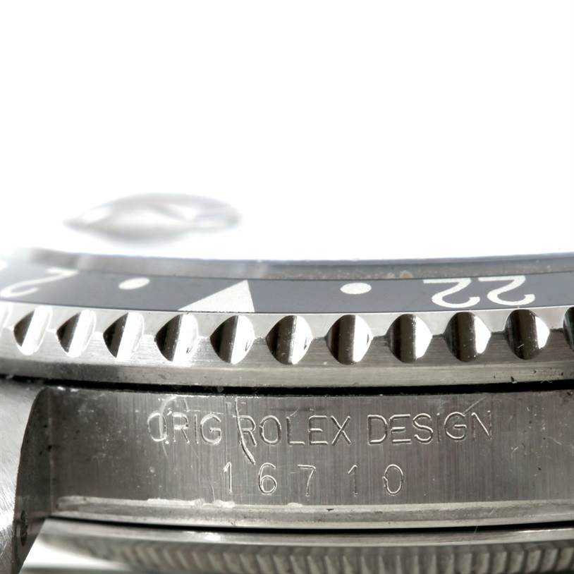 The image shows a close-up of the bezel and case side with the serial number of a Rolex GMT-Master 16710 Men's Stainless Steel Black Dial 16710 Men's Stainless Steel Black Dial.