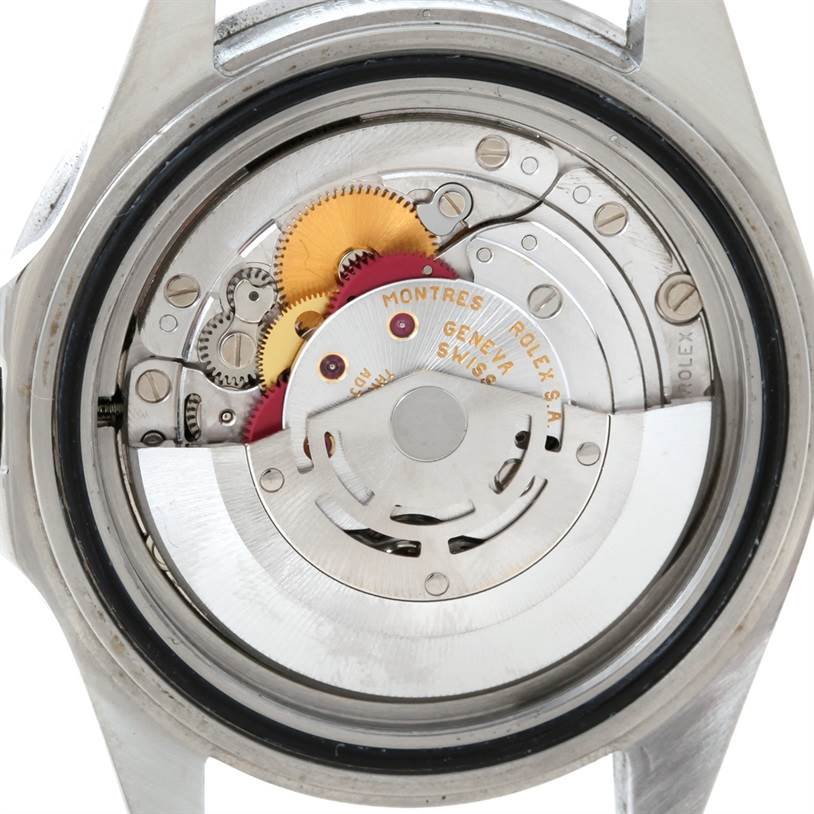 The image shows the backside of the Rolex GMT-Master 16710 Men's Stainless Steel Black Dial 16710 Men's Stainless Steel Black Dial watch, revealing its internal movement parts and mechanisms.