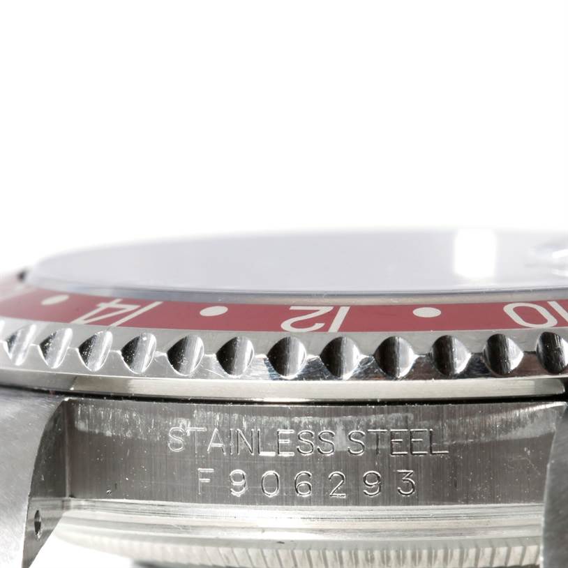 The image shows a close-up side view of a Rolex GMT-Master 16710 Men's Stainless Steel Black Dial 16710 Men's Stainless Steel Black Dial watch, highlighting the bezel, case, and serial number.