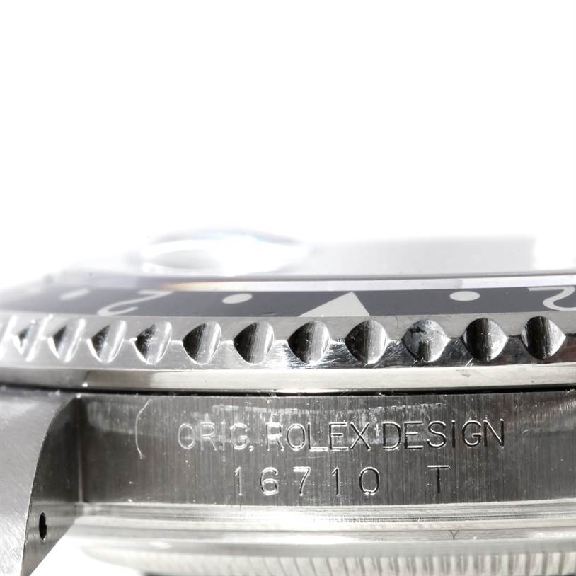 This image shows a close-up side view of the bezel and case of a Rolex GMT-Master 16710 Men's Stainless Steel Black Dial 16710 Men's Stainless Steel Black Dial model, displaying the model number 16710.