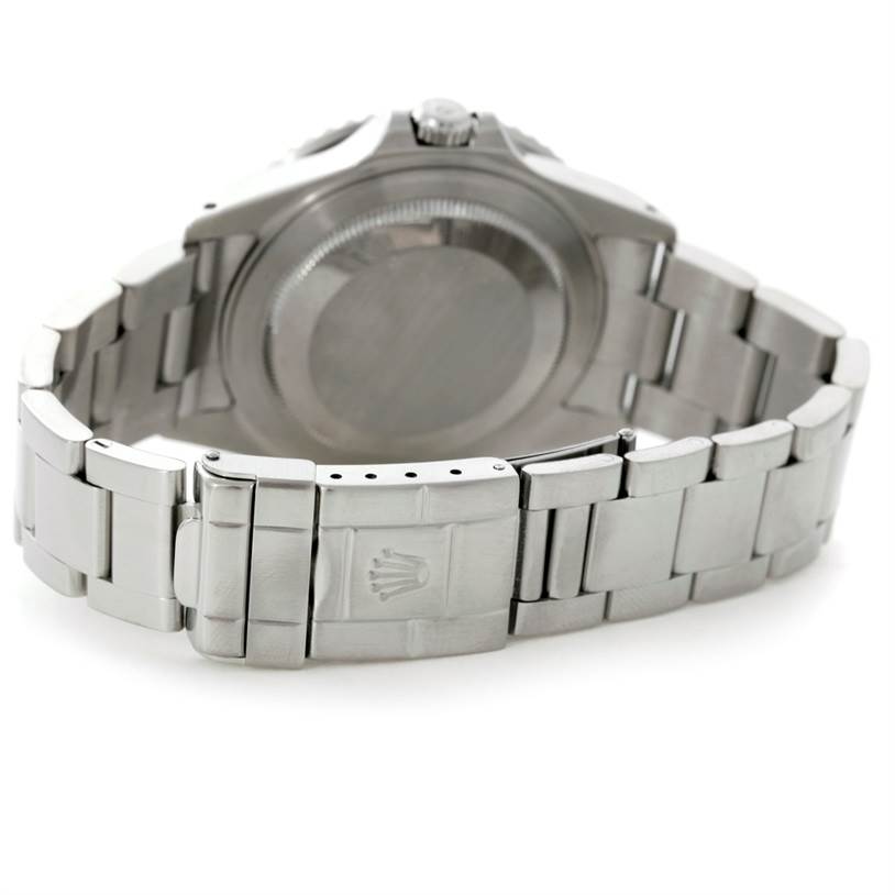 The image shows the back case and partly opened metal bracelet of a Rolex GMT-Master 16710 Men's Stainless Steel Black Dial 16710 Men's Stainless Steel Black Dial watch.