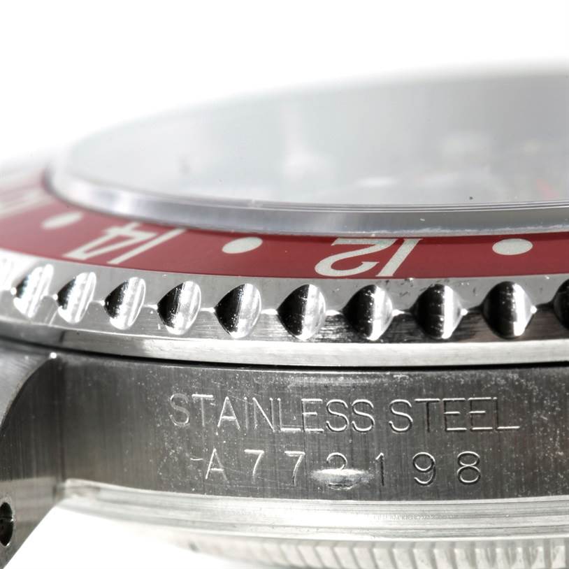The image shows a close-up of the bezel, casing, and serial number of a Rolex GMT-Master 16710 Men's Stainless Steel Black Dial 16710 Men's Stainless Steel Black Dial watch.