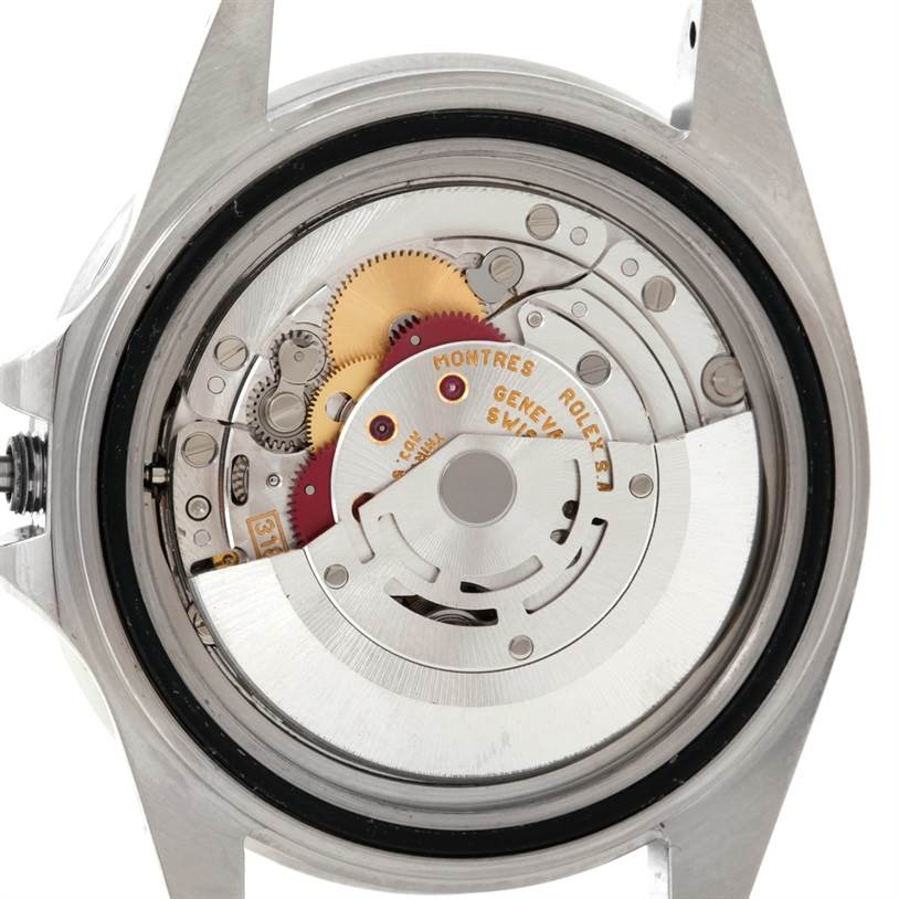 This image shows the inner mechanism of a Rolex GMT-Master 16710 Men's Stainless Steel Black Dial 16710 Men's Stainless Steel Black Dial watch from a rear view angle with its case back removed.