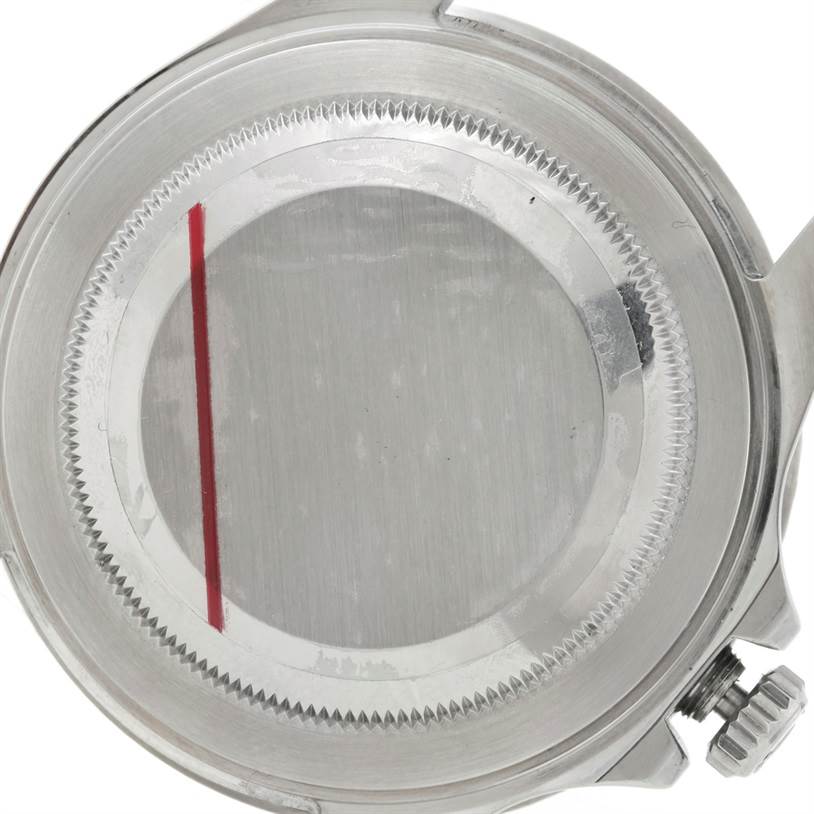 This image shows the caseback and part of the crown of a Rolex GMT-Master 16710 Men's Stainless Steel Black Dial 16710 Men's Stainless Steel Black Dial watch from a top-down angle.