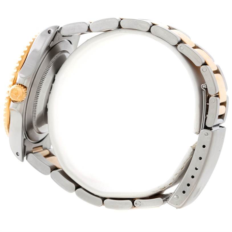 The Rolex GMT-Master 16713 Men's Stainless Steel Black Dial 16713 Men's Stainless Steel Black Dial watch is shown from the side, displaying its case, crown, and two-tone bracelet.