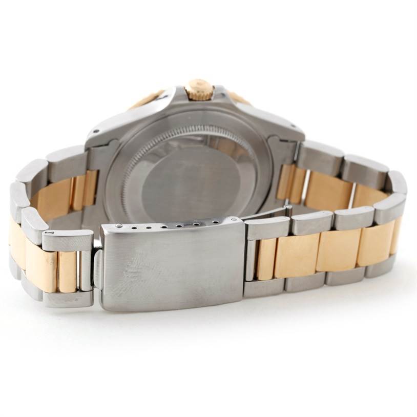 This image shows the back view of a Rolex GMT-Master 16713 Men's Stainless Steel Black Dial 16713 Men's Stainless Steel Black Dial watch, highlighting its clasp and two-tone bracelet.