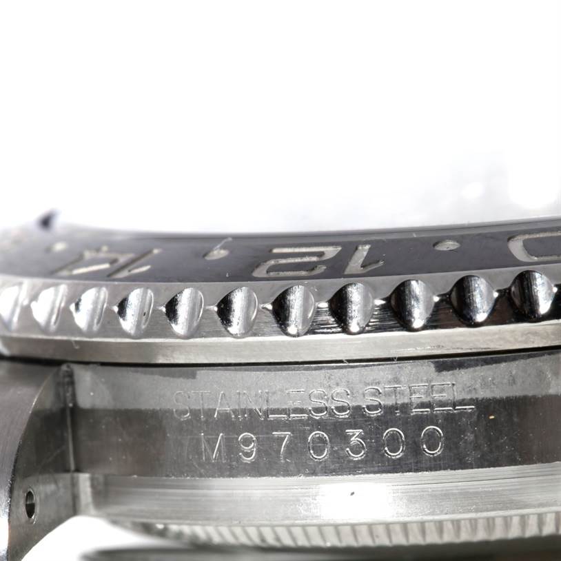 The image shows a close-up side view of the stainless steel bezel and case of a Rolex GMT-Master 116710 Men's Stainless Steel Black Dial 116710 Men's Stainless Steel Black Dial watch, with the model number visible.